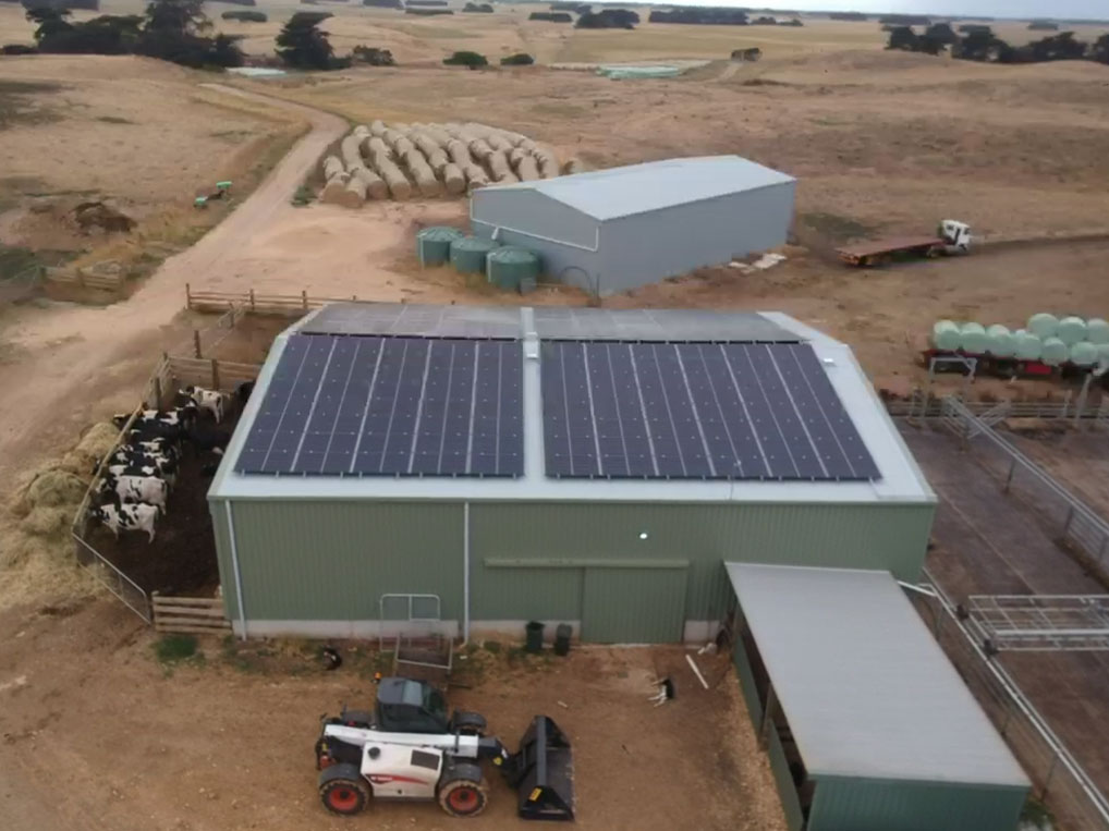 Aerial view of commercial dairy farm solar installation in Victoria